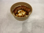Saucisse du moment au jus, purée