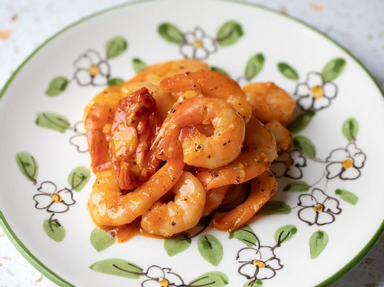 Gambas relevées aux tomates confites